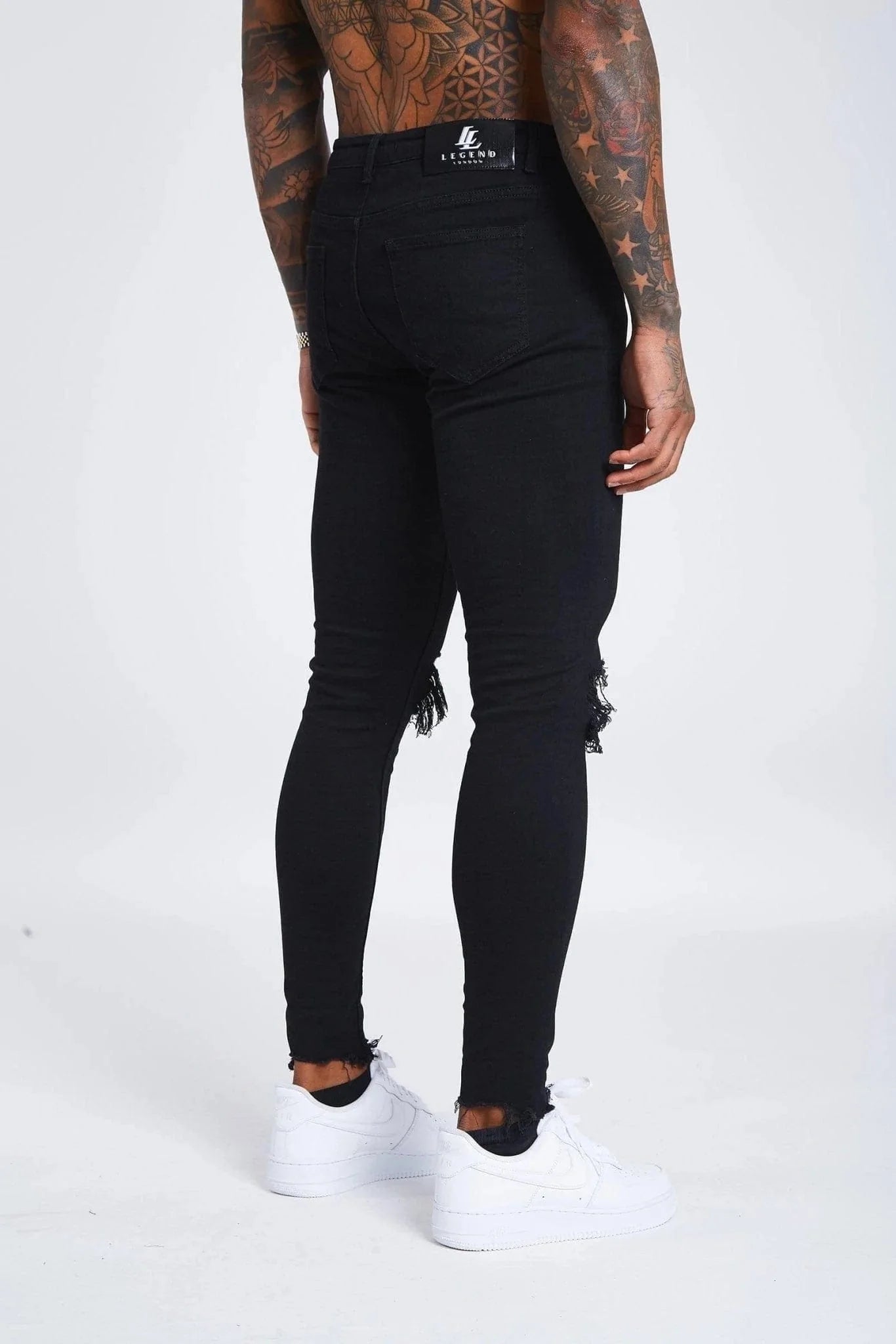 JEAN SKINNY FIT DÉTRUITE AU GENOU - NOIR