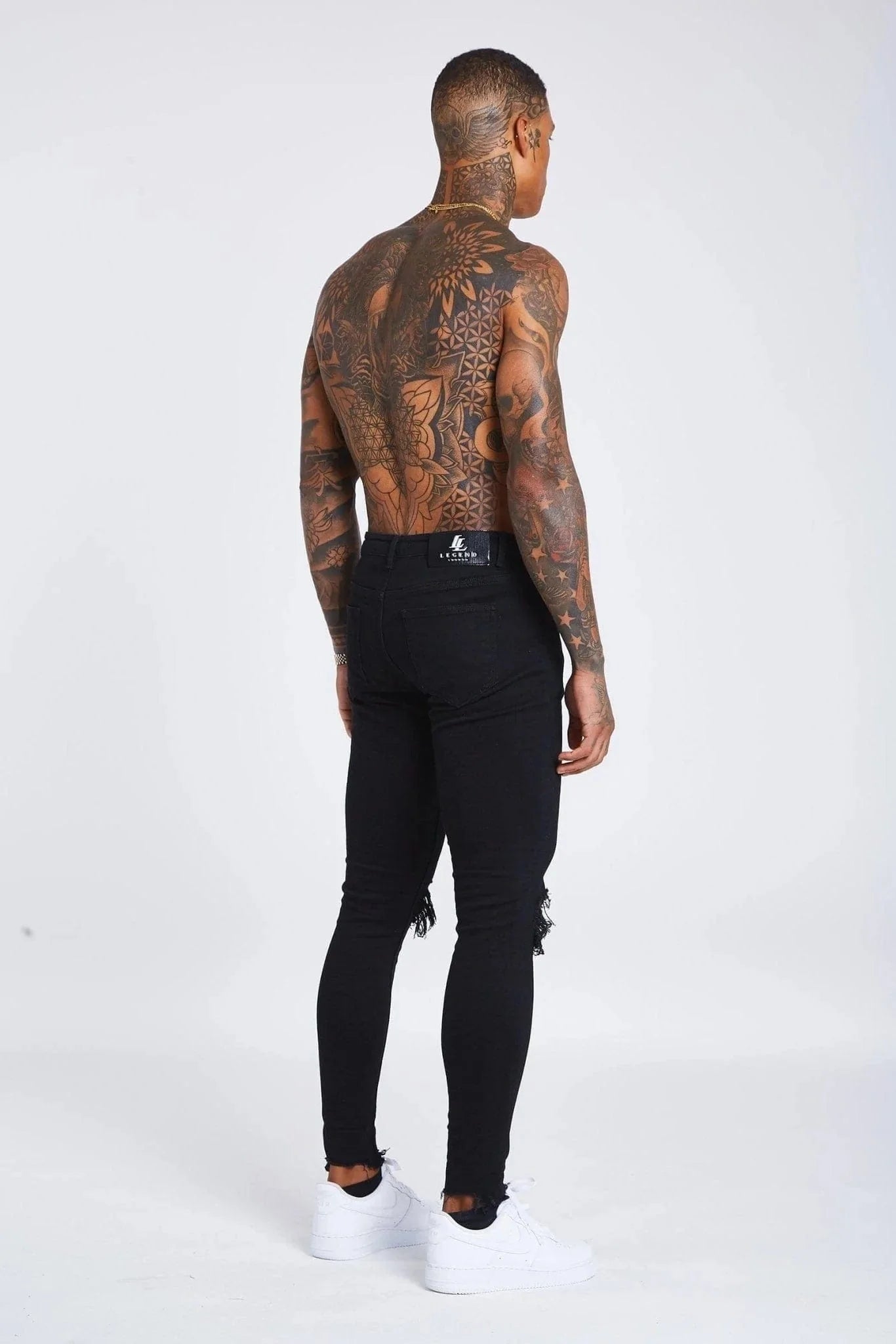 JEAN SKINNY FIT DÉTRUITE AU GENOU - NOIR