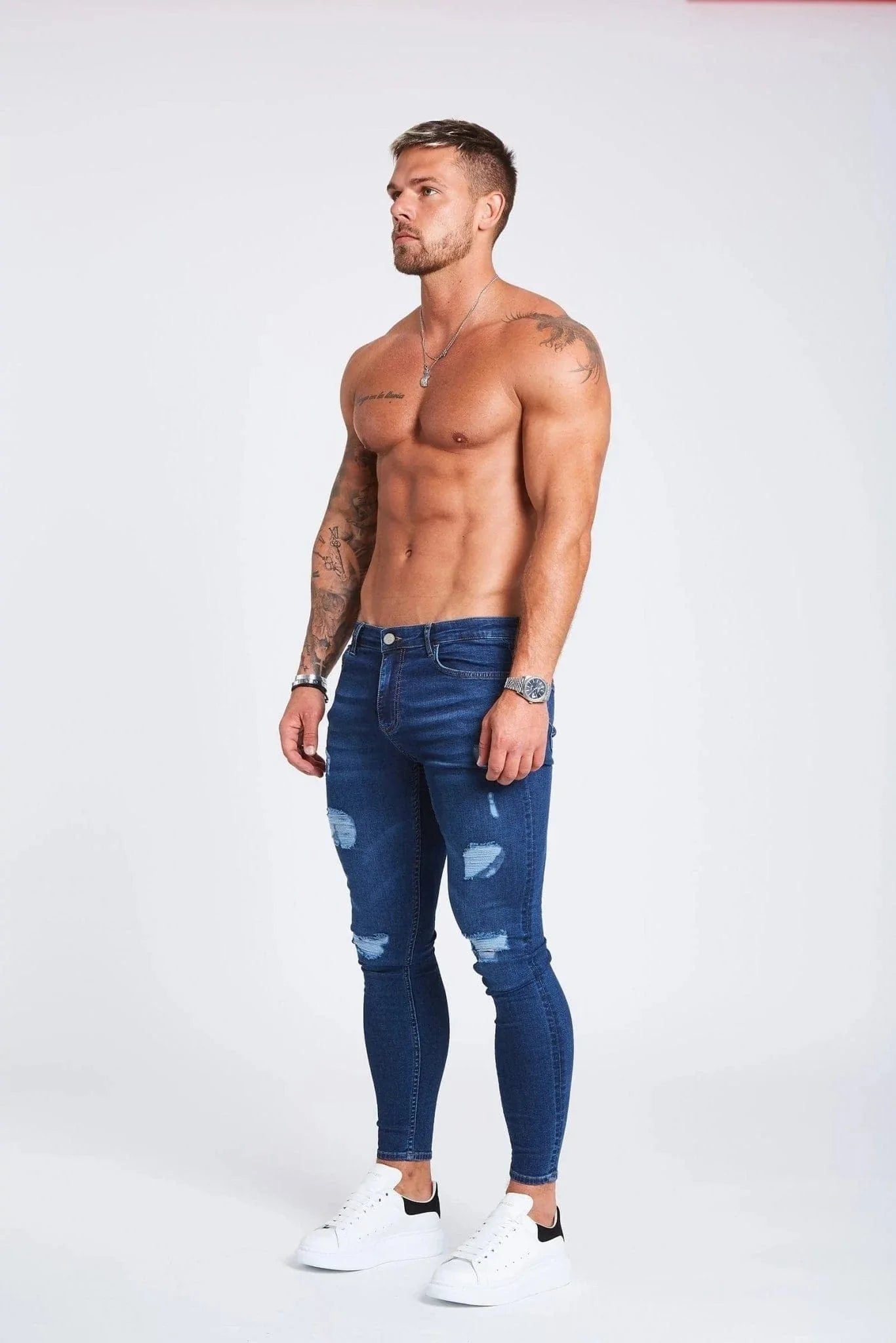 SKINNY FIT JEANS RIPPED AND REPAIRED - DARK BLUE