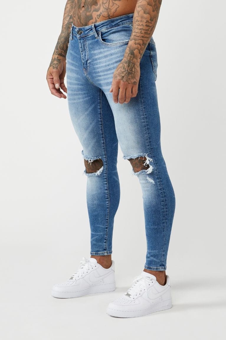 JEAN SKINNY FIT PREMIUM GENOU DÉTRUIT - DÉLAVAGE BLEU MOYEN