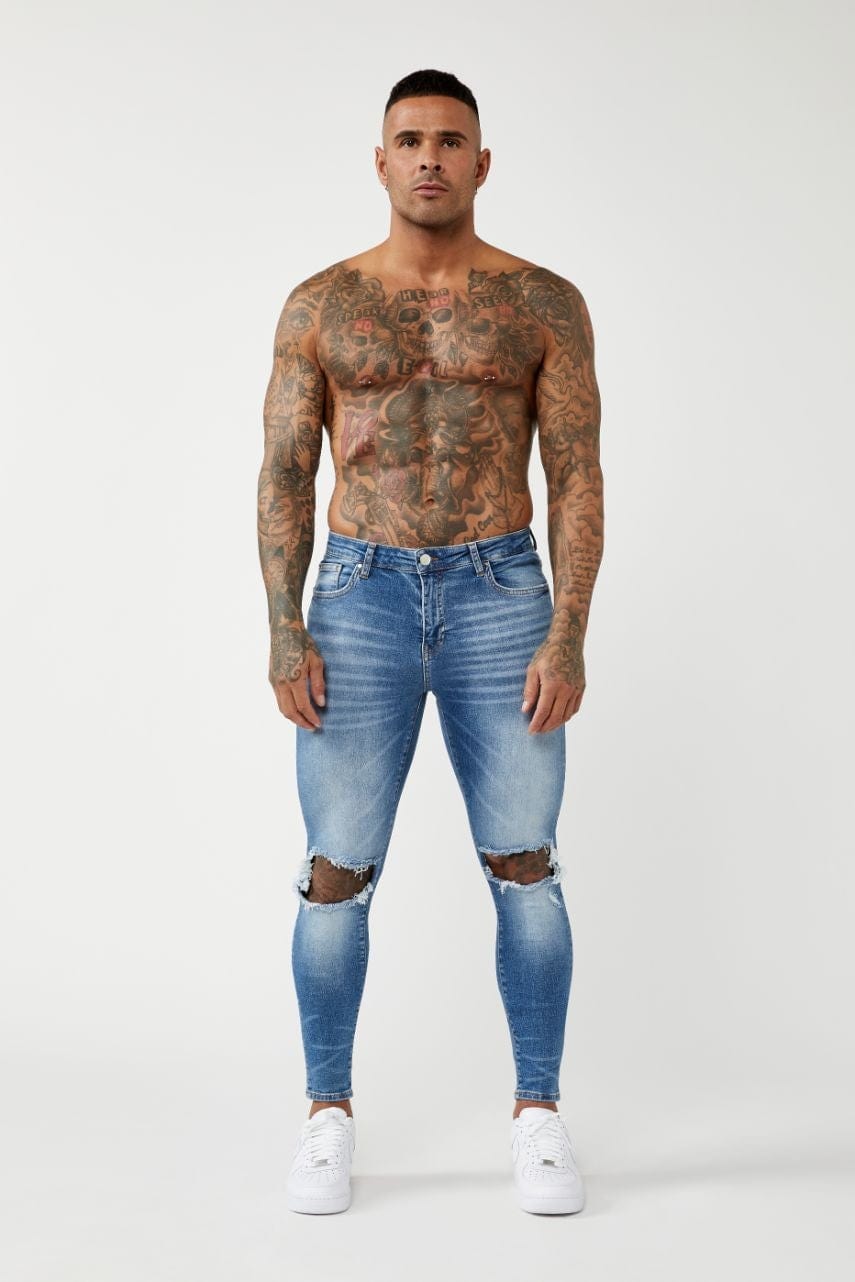 PREMIUM SKINNY FIT JEANS DESTROYED KNEE - MID BLUE WASH